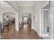 Open foyer with hardwood floors, arched doorways and views into the living spaces at 114 Montgomery Ln, Villa Rica, GA 30180