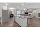 Open-concept kitchen with an island flowing into the living area at 114 Montgomery Ln, Villa Rica, GA 30180