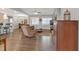 Open-concept living area featuring hardwood floors, comfortable seating, and ample natural light at 114 Montgomery Ln, Villa Rica, GA 30180
