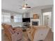 Cozy living room with wood floors, fireplace, and comfortable seating under a ceiling fan at 114 Montgomery Ln, Villa Rica, GA 30180