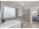 The main bathroom shows a glass shower, soaking tub, and natural light at 114 Montgomery Ln, Villa Rica, GA 30180