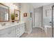 The main bathroom features double sinks, white cabinets, and tiled floors at 114 Montgomery Ln, Villa Rica, GA 30180