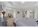 Spacious main bedroom showing a large bed, dresser, and an ensuite bathroom at 114 Montgomery Ln, Villa Rica, GA 30180