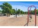 Community playground featuring swings and picnic area with mature trees providing shade at 114 Montgomery Ln, Villa Rica, GA 30180