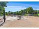 Community playground with swing sets, picnic tables, and play equipment, surrounded by trees at 114 Montgomery Ln, Villa Rica, GA 30180
