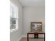 Cozy sitting area with a framed picture on a console table near a bright window at 114 Montgomery Ln, Villa Rica, GA 30180