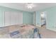 Spacious bedroom with light-green walls and a view into the bathroom at 362 Battle Woods Nw Trl, Marietta, GA 30064