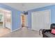 Blue bedroom featuring a view into the bathroom and a large closet at 362 Battle Woods Nw Trl, Marietta, GA 30064