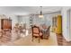Formal dining room boasts hardwood floors, a tray ceiling, ample natural light, and elegant furnishings at 362 Battle Woods Nw Trl, Marietta, GA 30064