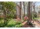 Stone and siding exterior with lush landscaping creates a tranquil setting at 362 Battle Woods Nw Trl, Marietta, GA 30064