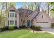 Charming two-story home with a well-manicured lawn, beautiful landscaping, and an attached two-car garage at 362 Battle Woods Nw Trl, Marietta, GA 30064