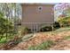 Back of home with stucco, landscaping, and a walkout basement at 362 Battle Woods Nw Trl, Marietta, GA 30064