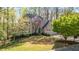Traditional home with an attached two-car garage and a charming blue front door at 362 Battle Woods Nw Trl, Marietta, GA 30064