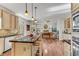 Open-concept kitchen flows into the living room, featuring granite countertops, a center island, and a breakfast bar at 362 Battle Woods Nw Trl, Marietta, GA 30064