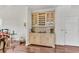 Living area featuring hardwood floors and a wine storage cabinet at 362 Battle Woods Nw Trl, Marietta, GA 30064