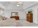 View of the main bedroom with plush carpeting, neutral colors, and a ceiling fan at 362 Battle Woods Nw Trl, Marietta, GA 30064