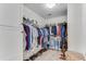 Well-appointed walk-in closet with hanging rods and shelves for optimal organization at 362 Battle Woods Nw Trl, Marietta, GA 30064