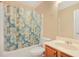 Cozy full bathroom with a tub-shower combination and decorative fish patterned curtain at 3642 Sunbridge Dr, Snellville, GA 30039