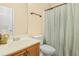 Clean bathroom features a vanity with sink, toilet, neutral paint, and shower with curtain at 3642 Sunbridge Dr, Snellville, GA 30039