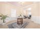 Elegant dining room featuring decorative molding and arched entryway, seamlessly connecting to the living spaces at 3642 Sunbridge Dr, Snellville, GA 30039