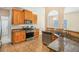 Well-equipped kitchen with stainless steel appliances, granite countertops, and ample cabinet space at 3642 Sunbridge Dr, Snellville, GA 30039