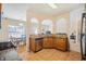 Well-lit kitchen featuring granite counters, stainless steel appliances, tile flooring, and open view to breakfast area at 3642 Sunbridge Dr, Snellville, GA 30039