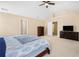 Bright main bedroom featuring carpet flooring, vaulted ceilings, neutral paint, large windows, and ensuite bathroom at 3642 Sunbridge Dr, Snellville, GA 30039