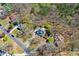 An aerial image shows the property situated amongst large trees and neighborhood streets at 507 Anthony Pl, Canton, GA 30114