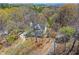 Stunning aerial view of home surrounded by mature trees and winding driveway at 507 Anthony Pl, Canton, GA 30114