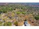 An aerial view showcases a home nestled amongst trees in a lush, green neighborhood at 507 Anthony Pl, Canton, GA 30114