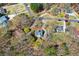 Aerial view of the home nestled in a community with mature trees and winding roads at 507 Anthony Pl, Canton, GA 30114