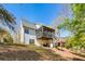The home's back exterior features a screened porch and outdoor deck at 507 Anthony Pl, Canton, GA 30114