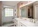Bright bathroom with a double vanity, spacious shower, and white subway tile at 507 Anthony Pl, Canton, GA 30114