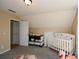 Bright Bedroom featuring a crib and changing table at 507 Anthony Pl, Canton, GA 30114