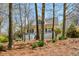 Charming home featuring a covered front porch and a beautifully landscaped front yard with mature trees at 507 Anthony Pl, Canton, GA 30114