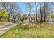Charming home with a covered front porch, landscaped yard, and a paved driveway for easy access at 507 Anthony Pl, Canton, GA 30114