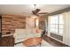 Bright living room with hardwood floors, neutral walls, and an accent wall of reclaimed wood at 507 Anthony Pl, Canton, GA 30114