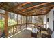 Inviting screened porch with wooden floors and seating, perfect for enjoying the outdoors at 507 Anthony Pl, Canton, GA 30114