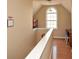Upstairs landing with a desk and a large arched window for plenty of natural light at 507 Anthony Pl, Canton, GA 30114