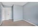 Cozy bedroom featuring neutral tones and an adjacent door at 111 Riverstone Commons Cir, Canton, GA 30114