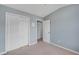 Bedroom showcasing neutral carpet, light blue walls, a window with curtains, and ample natural light at 111 Riverstone Commons Cir, Canton, GA 30114