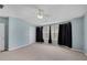 Spacious bedroom with light blue walls and large windows at 111 Riverstone Commons Cir, Canton, GA 30114