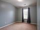 Cozy bedroom with neutral carpet, gray walls, a window and ample natural light at 111 Riverstone Commons Cir, Canton, GA 30114