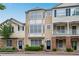 Lovely townhomes displaying unique front facades, manicured greenery, and welcoming entrances at 111 Riverstone Commons Cir, Canton, GA 30114