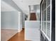 Bright foyer featuring hardwood floors, staircase, and elegant white trim, offering a welcoming entrance at 111 Riverstone Commons Cir, Canton, GA 30114