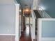 Bright foyer with hardwood floors, staircase, and neutral paint, creating a welcoming ambiance at 111 Riverstone Commons Cir, Canton, GA 30114