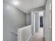 Second floor hallway leading to a bedroom with an open doorway and closet at 111 Riverstone Commons Cir, Canton, GA 30114