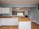 Open kitchen with a view to the living room and a breakfast bar at 111 Riverstone Commons Cir, Canton, GA 30114