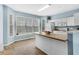 Bright kitchen with white cabinetry, modern appliances, and a breakfast bar at 111 Riverstone Commons Cir, Canton, GA 30114