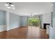 Spacious living room with fireplace, wood floors, and sliding glass doors to a patio at 111 Riverstone Commons Cir, Canton, GA 30114